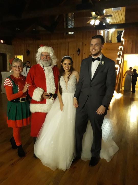 Even Newlyweds want a pic with Santa and his Elf